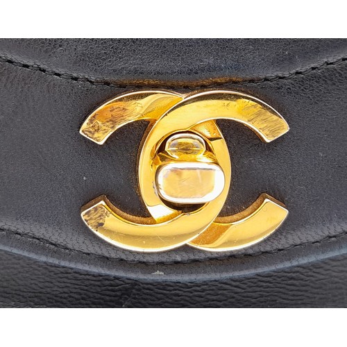 81 - A Chanel (Coco Mark) Lambskin Single Flap Double Chain Bag. Gold tone hardware including CC clasp. R... 