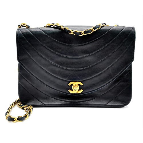 81 - A Chanel (Coco Mark) Lambskin Single Flap Double Chain Bag. Gold tone hardware including CC clasp. R... 