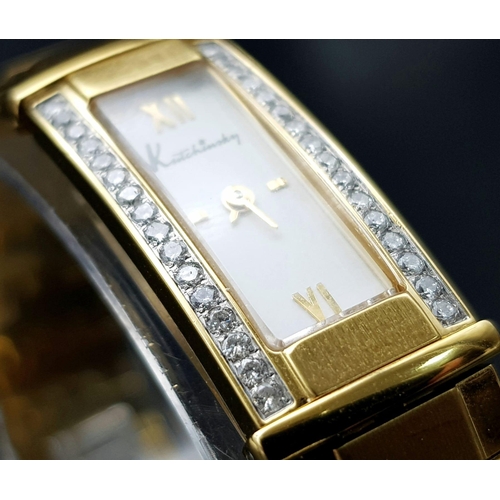 117 - AN ORIGINAL KUTCHINSKY GOLD TONE BRACELET LADIES WATCH - WITH DIAMONDS SET EITHER SIDE OF THE DIAL. ... 