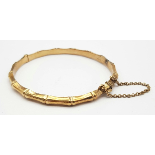 184 - A 9K GOLD HINGED BANGLE IN BAMBOO STYLE .   9.0gms