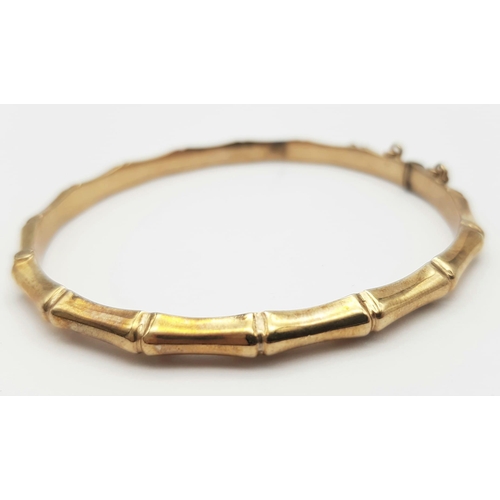 184 - A 9K GOLD HINGED BANGLE IN BAMBOO STYLE .   9.0gms