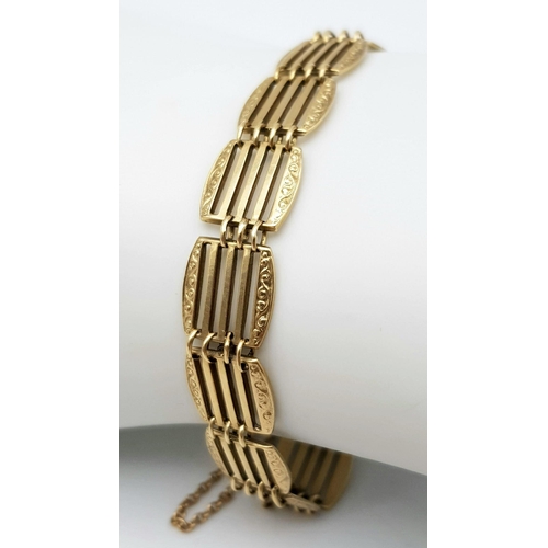 191 - A 9K GOLD ORNATELY DECORATED GATE BRACELET .   11.1gms