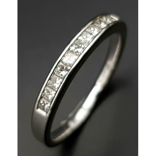 200 - AN 18K WHITE GOLD DIAMOND 1/2 ETERNITY RING. CHANNEL SET PRINCESS CUTS. 0.35CTW. 2.5G. SIZE M