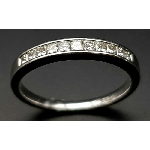 200 - AN 18K WHITE GOLD DIAMOND 1/2 ETERNITY RING. CHANNEL SET PRINCESS CUTS. 0.35CTW. 2.5G. SIZE M