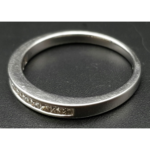 200 - AN 18K WHITE GOLD DIAMOND 1/2 ETERNITY RING. CHANNEL SET PRINCESS CUTS. 0.35CTW. 2.5G. SIZE M