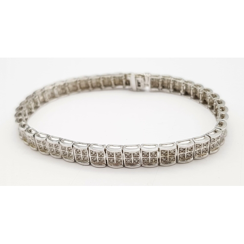 54 - A 9K White Gold Diamond Set Bracelet, with Under Safety Catch Fitting. 1ctw, 19cm length, 12.7g tota... 