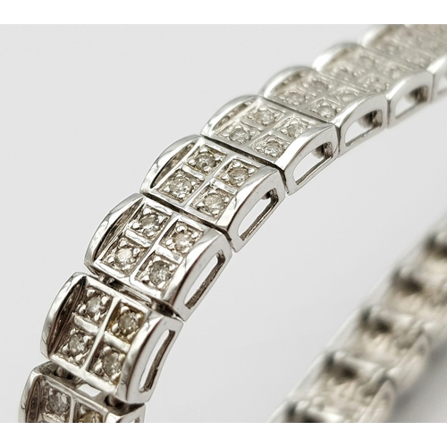 54 - A 9K White Gold Diamond Set Bracelet, with Under Safety Catch Fitting. 1ctw, 19cm length, 12.7g tota... 