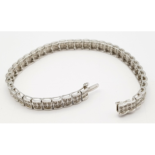 54 - A 9K White Gold Diamond Set Bracelet, with Under Safety Catch Fitting. 1ctw, 19cm length, 12.7g tota... 