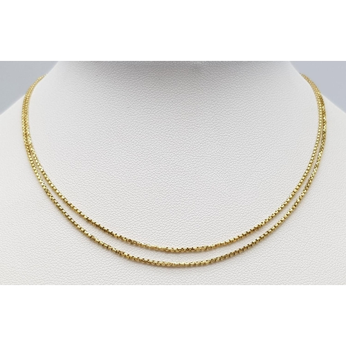 345 - An 18K Yellow Gold Petite Square Link Necklace. 62cm. 5g