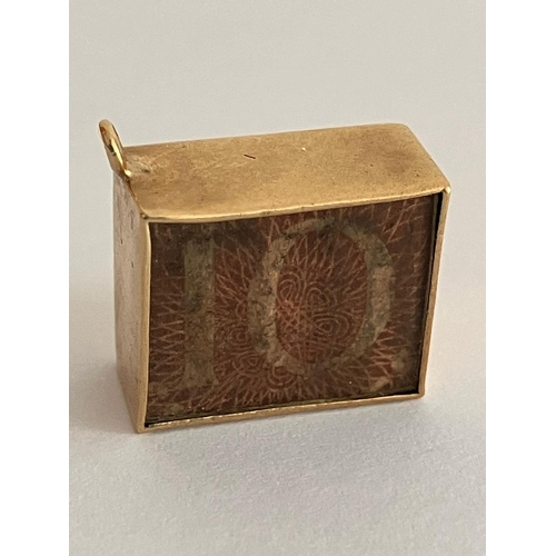 237 - Vintage 9 carat GOLD CHARM, Consisting a 10 SHILLING NOTE folded inside a GOLD  case. 2.3 Grams.