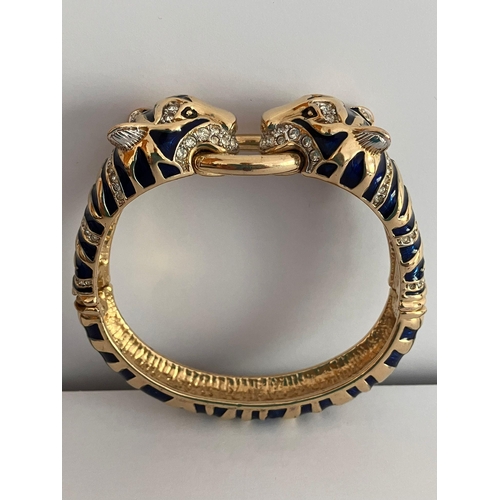 112 - Vintage ‘Duchess of Windsor’ LEOPARD BANGLE. Heavily decorated with blue enamel and clear gemstones.... 