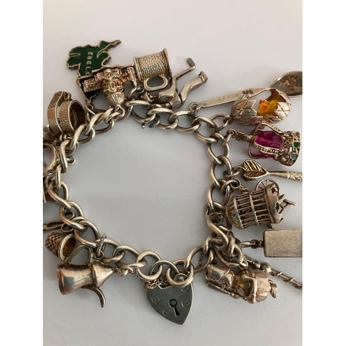 153 - Vintage SILVER CHARM BRACELET Full of interesting Silver Charms to include Caravan, Egg with Chick, ... 