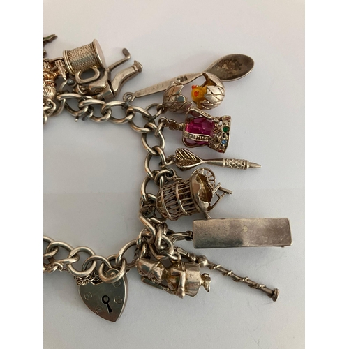 153 - Vintage SILVER CHARM BRACELET Full of interesting Silver Charms to include Caravan, Egg with Chick, ... 