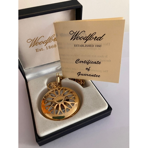 A WOODFORD SKELETON HALF HUNTER POCKET WATCH. Gold Plated finish with ...