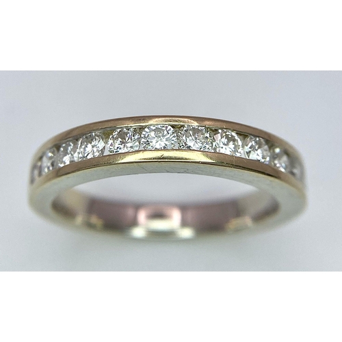 226 - An 18K Yellow Gold Diamond Half Eternity Ring. 12 brilliant round cut diamonds - 0.60ctw. Size N. 4.... 