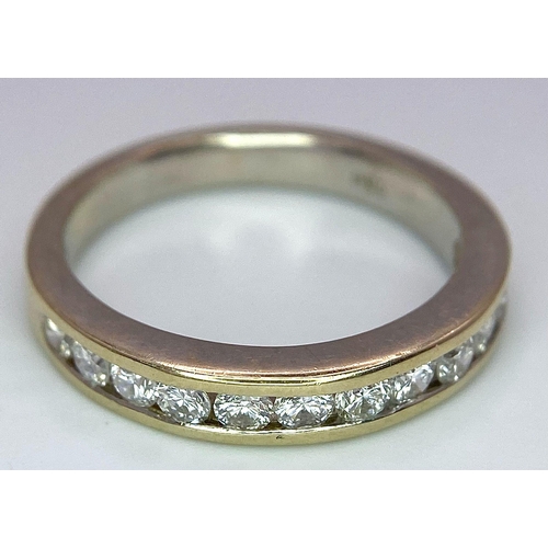 226 - An 18K Yellow Gold Diamond Half Eternity Ring. 12 brilliant round cut diamonds - 0.60ctw. Size N. 4.... 