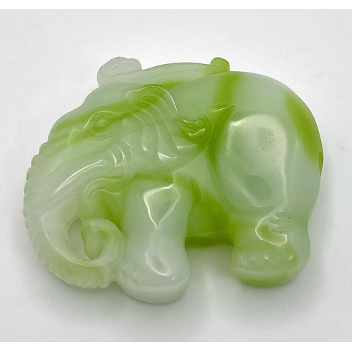 445 - A Chinese Green and White Jade Elephant Figurine Pendant. 
5cm x 4cm.