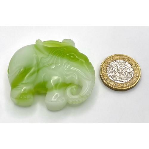 445 - A Chinese Green and White Jade Elephant Figurine Pendant. 
5cm x 4cm.