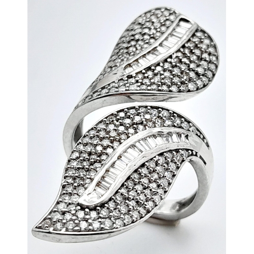 132 - An incredibly attractive sterling silver and 14 K white gold-plated ring with a naturalistic design ... 