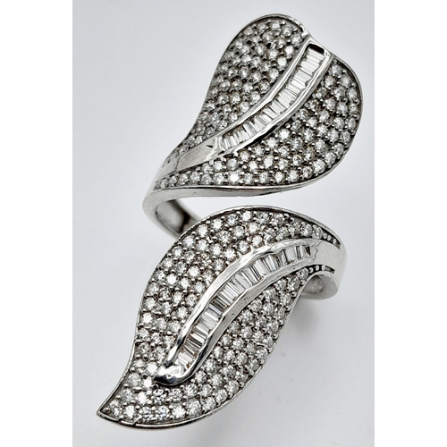 132 - An incredibly attractive sterling silver and 14 K white gold-plated ring with a naturalistic design ... 