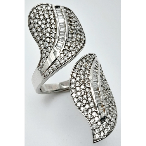 132 - An incredibly attractive sterling silver and 14 K white gold-plated ring with a naturalistic design ... 