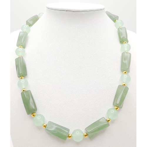 195 - A high-quality light green, semi-translucent, jade necklace, bracelet and earrings set. Necklace len... 