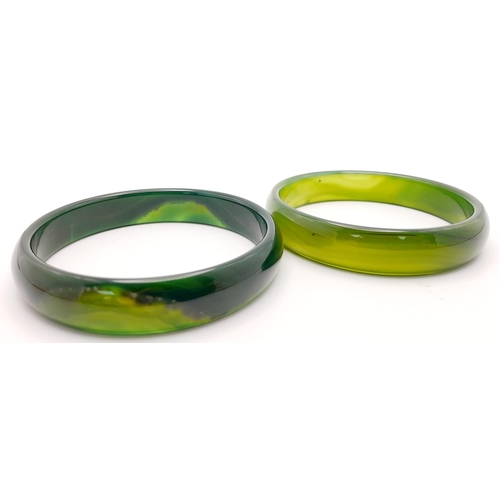 223 - Two top quality, highly polished, spinach green jade bangles, 68 mm inner diameter, each in gift box... 