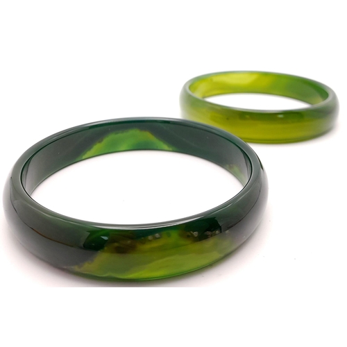 223 - Two top quality, highly polished, spinach green jade bangles, 68 mm inner diameter, each in gift box... 