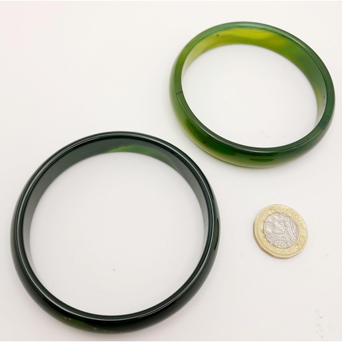 223 - Two top quality, highly polished, spinach green jade bangles, 68 mm inner diameter, each in gift box... 