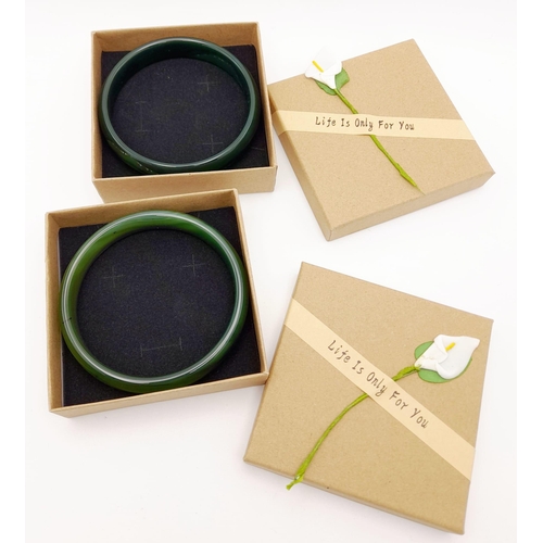 223 - Two top quality, highly polished, spinach green jade bangles, 68 mm inner diameter, each in gift box... 