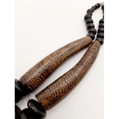 244 - An East African talisman’s necklace, made with snakeskin and other materials, used by voodoo doctors... 