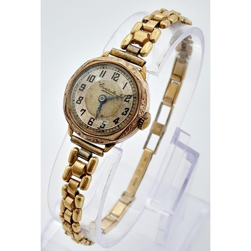 428 - A Vintage 9K Gold Cased Everite Ladies Watch. Gold plated bracelet. 9K gold case - 21mm. Patinaed di... 