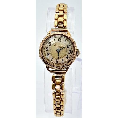 428 - A Vintage 9K Gold Cased Everite Ladies Watch. Gold plated bracelet. 9K gold case - 21mm. Patinaed di... 