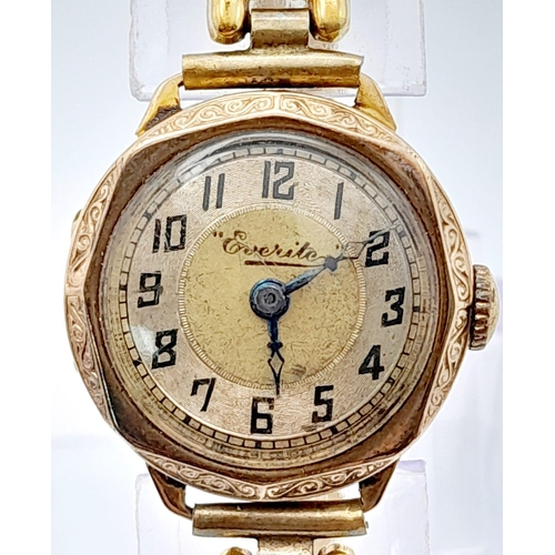 428 - A Vintage 9K Gold Cased Everite Ladies Watch. Gold plated bracelet. 9K gold case - 21mm. Patinaed di... 