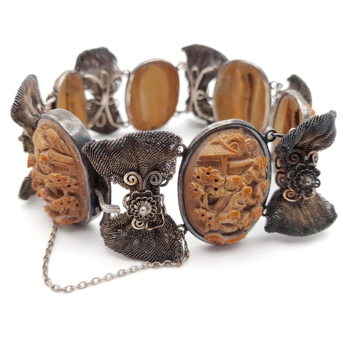 443 - An Antique Victorian Carved Lava and Silver Bracelet. Beautifully crafted in high relief. 18cm