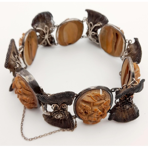 443 - An Antique Victorian Carved Lava and Silver Bracelet. Beautifully crafted in high relief. 18cm