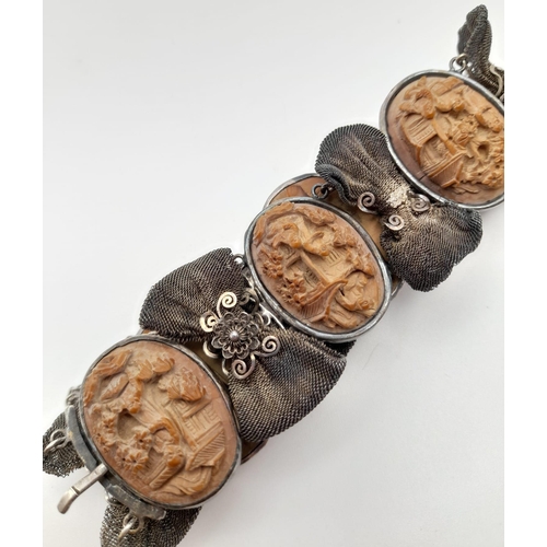 443 - An Antique Victorian Carved Lava and Silver Bracelet. Beautifully crafted in high relief. 18cm