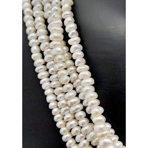 181 - A vintage, five row, natural, white pearl necklace, with a statement gold plated clasp. Length: 42 c... 