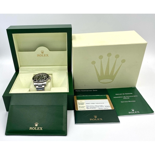 23 - A Rolex Submariner Date Automatic Gents Watch. Stainless steel bracelet and case - 41mm. Black dial ... 