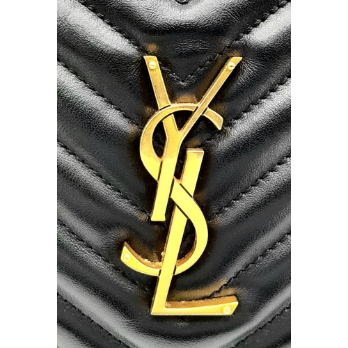 41 - A YSL Saint Laurent Black Lou Matelasse Camera Bag. Leather exterior, gold-tone hardware, adjustable... 