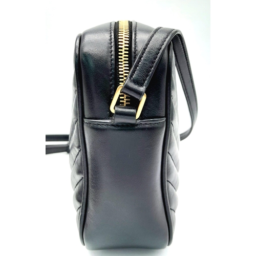 41 - A YSL Saint Laurent Black Lou Matelasse Camera Bag. Leather exterior, gold-tone hardware, adjustable... 