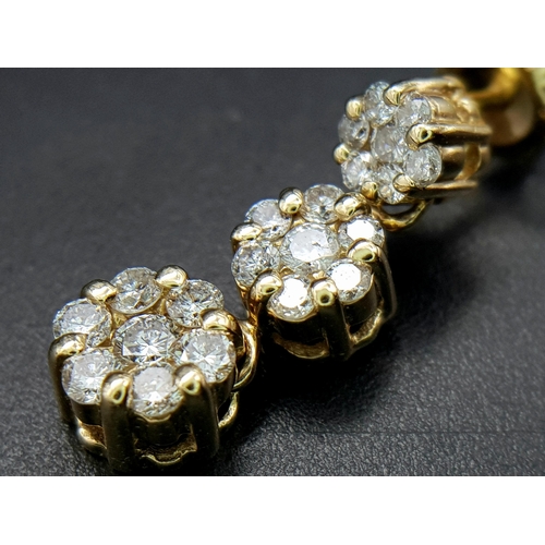 191 - A Pair of 14K Yellow Gold and Diamond Drop Earrings. A total of 42 round cut diamonds - 1ctw. H-I in... 