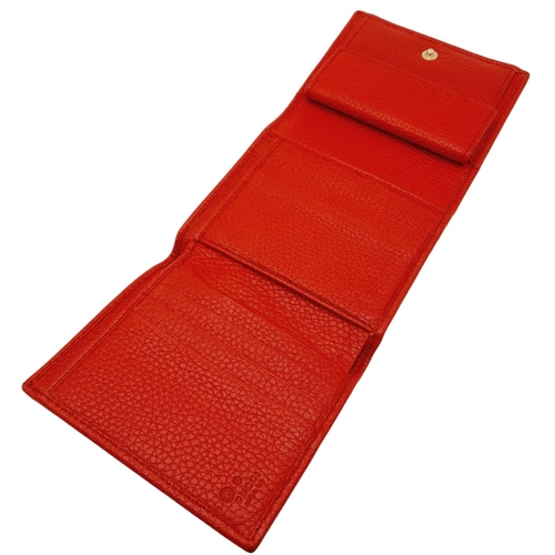 199 - A Gucci Red Trifold Wallet. Leather exterior with the GG logo and press stud closure. Red leather in... 