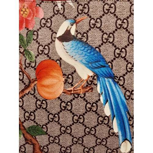 95 - A Gucci Monogram 'Tian' Clutch Bag. Leather exterior with a depiction of a bird in nature, red leath... 