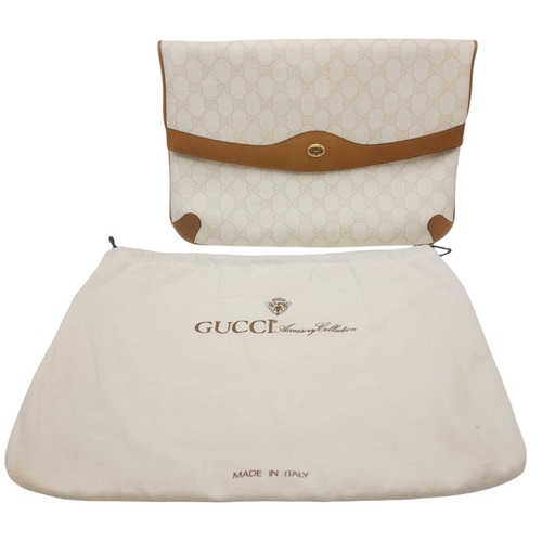 150 - A Gucci Ivory GG Monogram Clutch Bag. Leather exterior with brown trim, gold and silver-toned GG, an... 