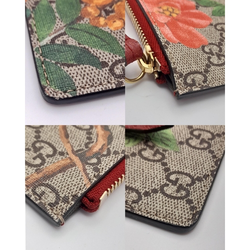 95 - A Gucci Monogram 'Tian' Clutch Bag. Leather exterior with a depiction of a bird in nature, red leath... 