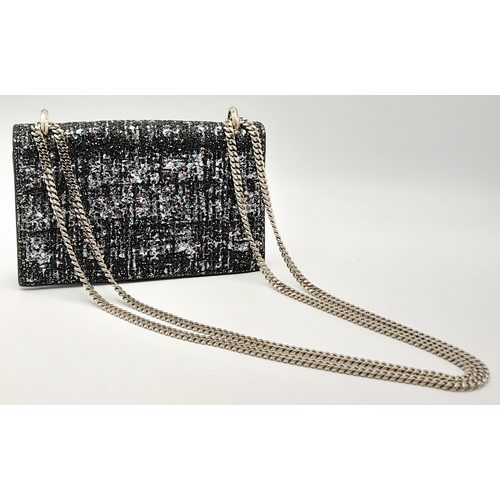 143 - A Jimmy Choo 'Leni' Glitter Crossbody Bag. Black leather and blue, pink and black glitter exterior w... 