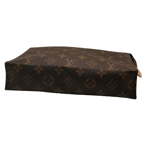 136 - A Louis Vuitton Monogram Poche Toilette Pouch. Leather exterior with gold-tone hardware, zipped top ... 