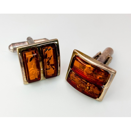 470 - A Pair of Amber and Silver Cufflinks. In original box with certificate. Ref: 016736