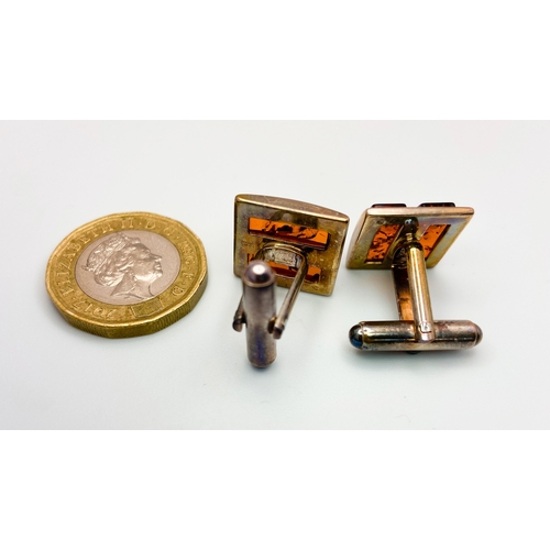 470 - A Pair of Amber and Silver Cufflinks. In original box with certificate. Ref: 016736